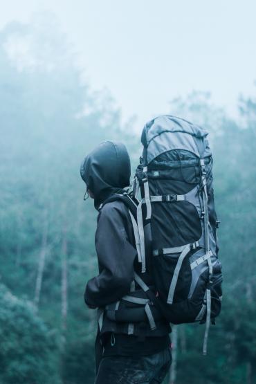 man-wearing-black-hoodie-carries-black-and-gray-backpacker-732632.jpg