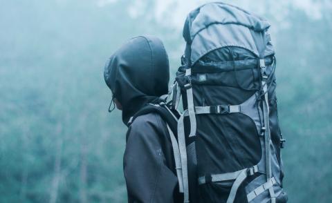 man-wearing-black-hoodie-carries-black-and-gray-backpacker-732632.jpg